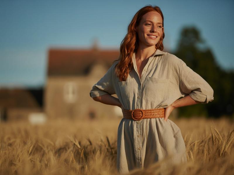 A woman wearing an oversized shirt dress