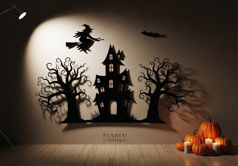 Balanced Halloween wall décor with one haunted house, two spooky tree cutouts, a flying witch, warm shadow lighting, and a small cluster of pumpkins and candles.
